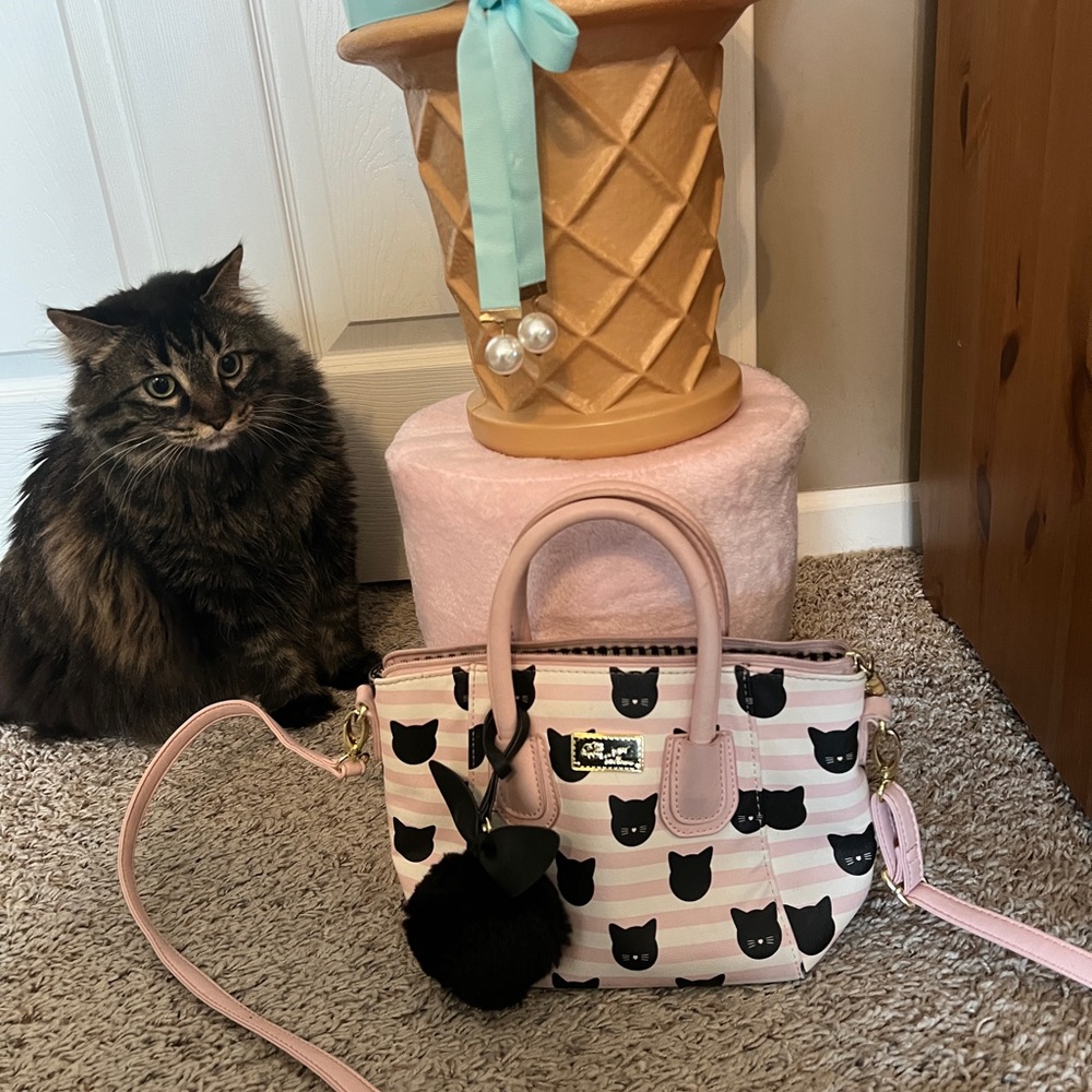 Great condition! Striped bubble gum pink and black with kitty cat poof